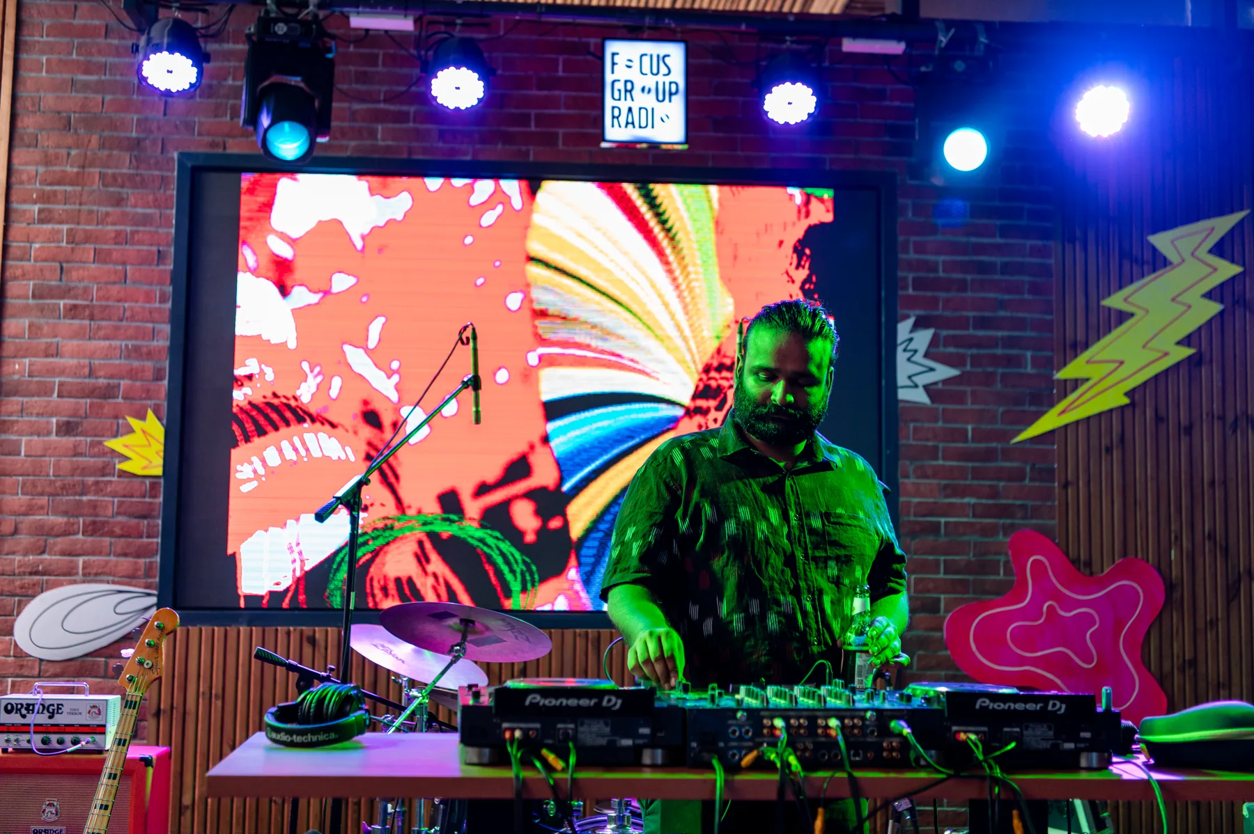 DJ performing in front of the main-stage visual system.
